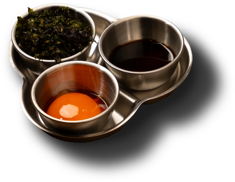One complimentary serving of TKG: egg yolk, seaweed and soy sauce